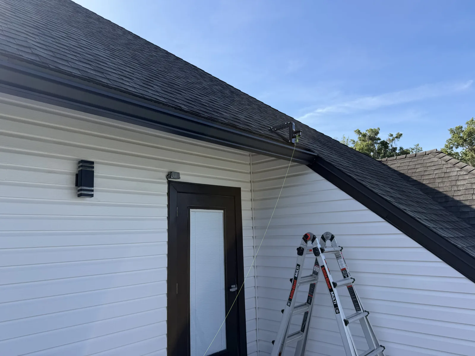 Custom roof-bracket mounting system carrying the awning off the roofline in Fruit Cove, FL
