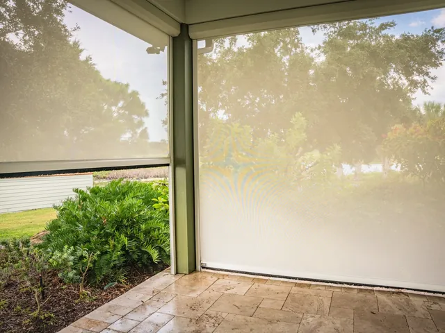 White-fabric privacy screens on a residential porch