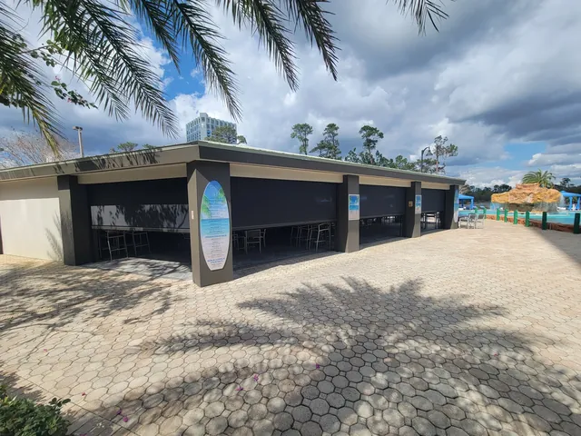 Black commercial solar screens at a waterpark walk-up bar