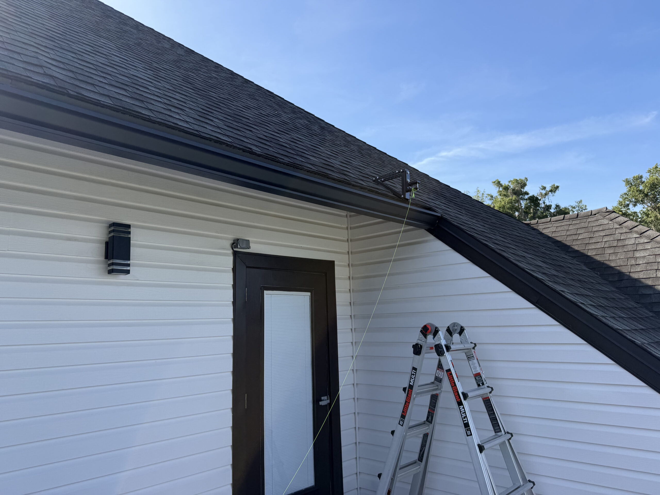 Custom roof-bracket mounting system carrying the awning off the roofline in Fruit Cove, FL