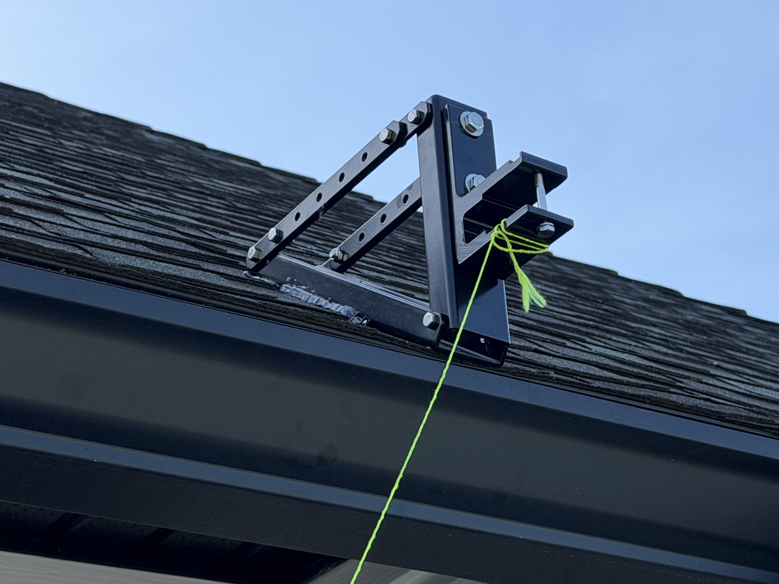 Close-up of the fabricated roof bracket securing the motorized awning in Fruit Cove, FL