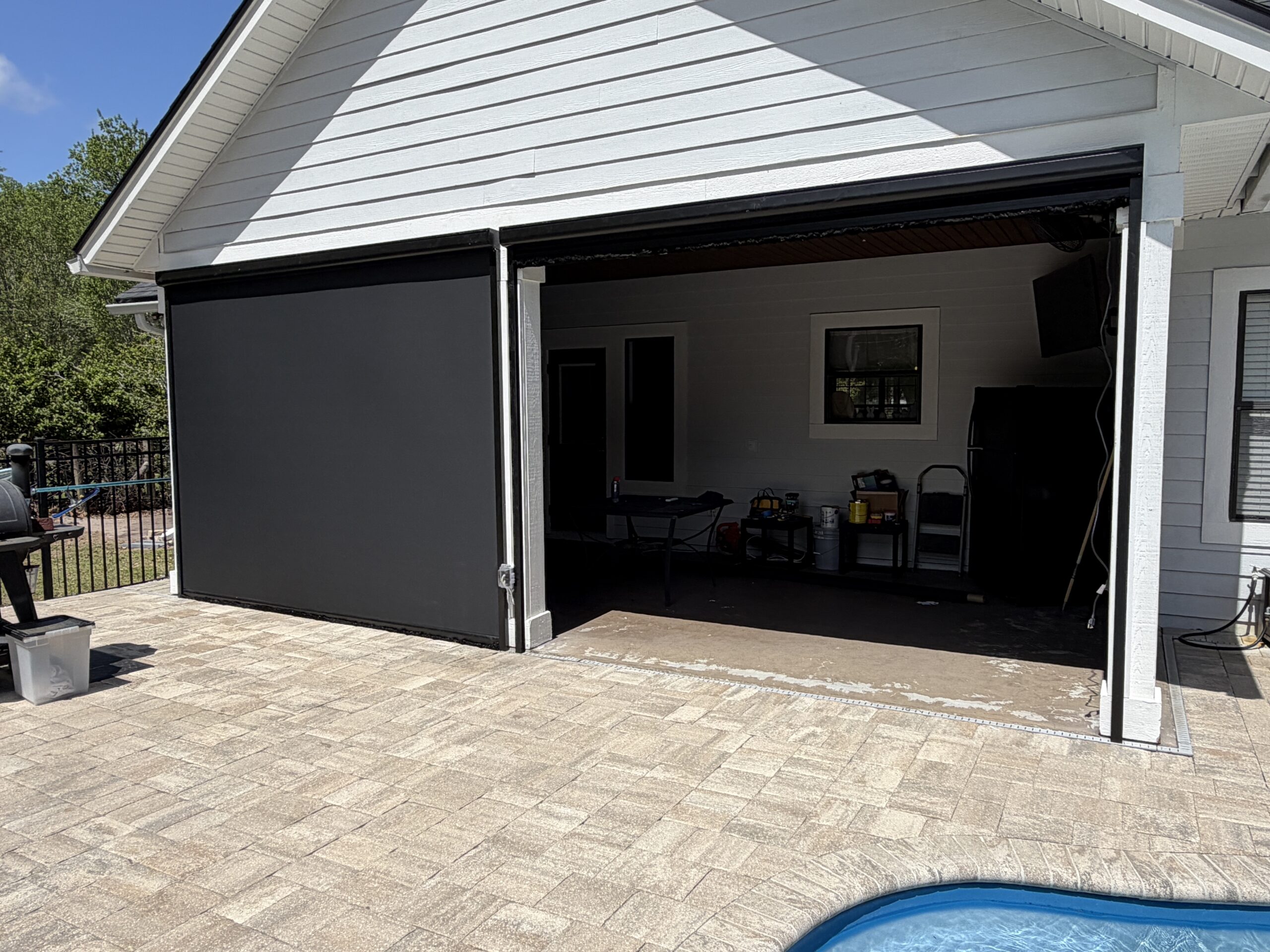 Motorized retractable screen using Textilene Nano 99 fabric on a lanai in Pecan Park, Jacksonville, FL